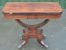 Regency brass strung rosewood card table, swivel folding baize lined top on open curved support