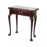 Property of a gentleman - a mid 18th century George II mahogany tea table, with eared foldover top