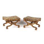 Property of a gentleman - a pair of 19th century gilt painted 'X'-frame stools, with floral