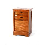 Property of a deceased estate - an oak filing cabinet with roller shutter enclosing six drawers,