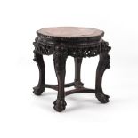 Property of a deceased estate - a Chinese carved hardwood stand with pink marble inset top,