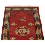 Property of a deceased estate - a Nepalese woollen hand-knotted rug, 54 by 28ins. (137 by 70cms.).