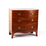 An early 19th century George III mahogany bow-fronted chest of two short & two long graduated