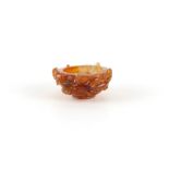 A small Chinese carved agate bowl, late 19th / early 20th century, with two chilong, 2.35ins. (