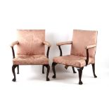 Property of a gentleman - a pair of George III mahogany library chairs, with carved cabriole front