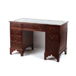 Property of a deceased estate - a reproduction mahogany veneered twin pedestal desk, with green