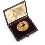 A Victorian unmarked gold oval cut citrine & turquoise brooch, 36mm long, in fitted box.