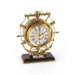 Property of a deceased estate - a late 19th century brass ship's wheel mantel clock timepiece, the