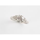 Property of a lady - a platinum diamond ring, the large round brilliant cut diamond weighing