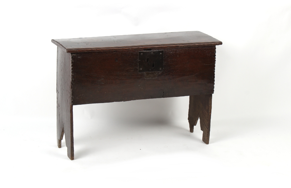 Property of a gentleman - a mid 17th century oak six plank coffer or boarded chest, of good