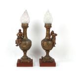 A large pair of late 19th / early 20th century spelter figural table lamps with frosted glass
