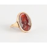 A gentleman's 9ct gold hardstone intaglio ring, the oval stone carved with a classical head, the