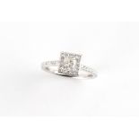 A platinum diamond square cluster ring, the centre GIA certificated square modified brilliant cut