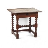 A late 17th / early 18th century oak side table, with frieze drawer, 27ins. (68.5cms.) wide (