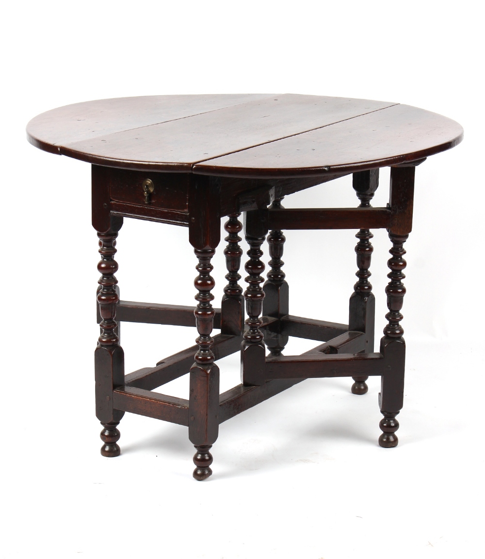 Property of a gentleman - a small William & Mary oak oval topped gate-leg table, circa 1670/80, of - Image 4 of 4