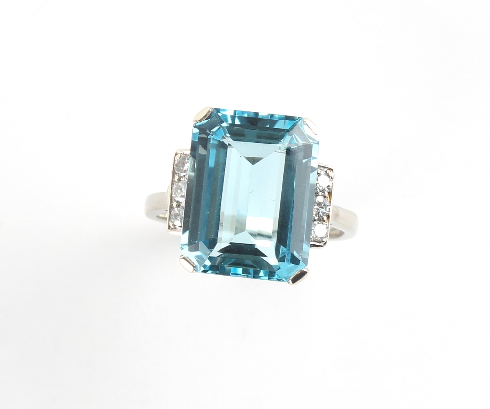 A good Art Deco style aquamarine & diamond ring, the vibrant blue octagonal cut aquamarine