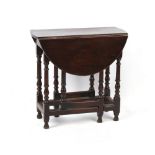 Property of a gentleman - a late 17th / early 18th century small oval topped gate-leg table, of good