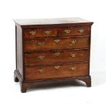 Property of a deceased estate - a George II oak & yew wood crossbanded chest of two short & three