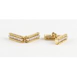 Tiffany & Co. - a pair of 18ct yellow gold diamond cufflinks, each with seven round brilliant cut