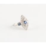 An 18ct white gold & platinum sapphire & diamond marquise shaped cluster ring, set with a further