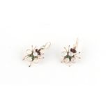 A pair of multi gem set insect earrings, set with cabochon moonstones, garnets & green stones,