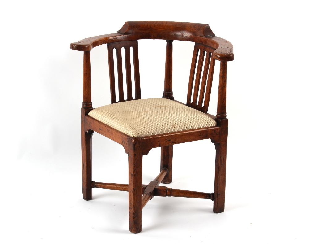 Property of a deceased estate - a George III elm corner chair, third quarter 18th century, with