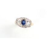 An Art Deco style 14ct yellow gold sapphire & diamond ring, the oval cut sapphire weighing