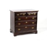 Property of a gentleman - an 18th century oak chest of two short & three long graduated drawers with