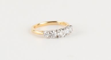 An 18ct yellow gold diamond five stone ring, the round brilliant cut diamonds weighing an