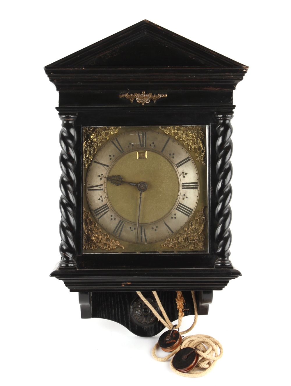 The Henry & Tricia Byrom Collection - an ebonised cased 30-hour hooded wall clock, with 10-inch