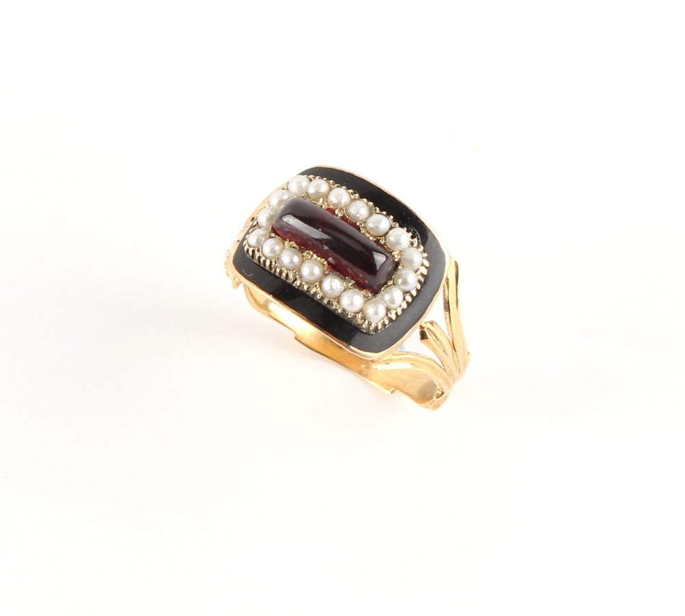 A 19th century gold black enamel & seed pearl mourning ring, set with a cabochon garnet, with bi- - Image 2 of 3