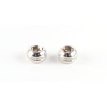 A pair of modern 18ct white gold diamond clip earrings, each set with nine round brilliant cut