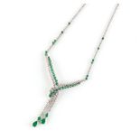 A good 18ct white gold emerald & diamond sautoir necklace, set with two pear shaped emeralds, two