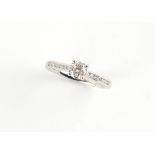 A platinum diamond single stone ring, the W.G.I. certificated round brilliant cut diamond weighing