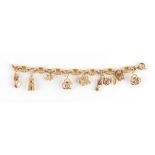 Property of a lady - a 9ct gold charm bracelet, with ten charms, approximately 19.6 grams total.