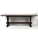Property of a deceased estate - a 17th century style oak refectory table, with cleated ends, the top