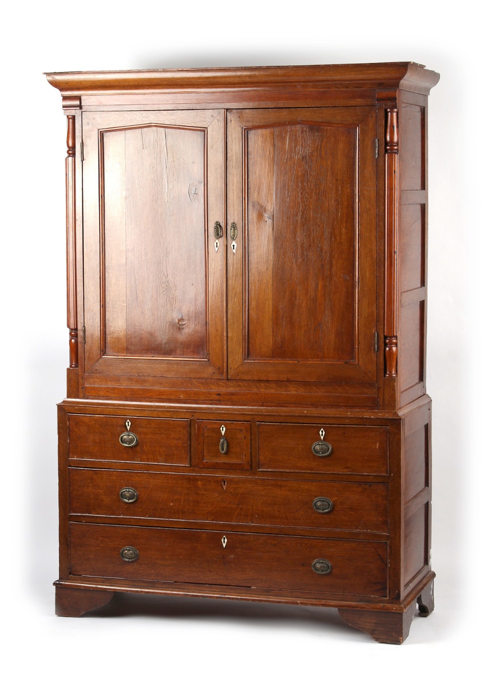 Property of a gentleman - a George III oak housekeeper's cupboard or linen press cupboard, in two
