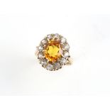 Property of a gentleman - a 9ct gold citrine & white stone (not diamonds) oval cluster ring,