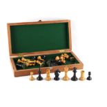 Property of a lady - a Staunton pattern boxwood & ebony chess set, the kings 3.45ins. (8.7cms.)