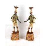 Property of a gentleman - a pair of carved & painted wood Blackamoor standard lamps, two fingers