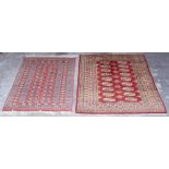Property of a gentleman - two Turkoman design hand-knotted wool rugs, 70 by 49ins. (178 by