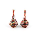 Property of a deceased estate - a pair of Keeling & Co. Losol Ware octagonal bottle vases, decorated
