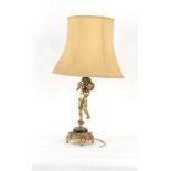 Property of a deceased estate - a brass cherub figural table lamp, with shade, approximately 36.