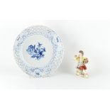 Property of a lady - a Meissen figure of a seated boy holding a basket of flowers, blue crossed