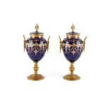 Property of a lady - a pair early 20th century ormolu or gilt brass mounted navy blue porcelain urns