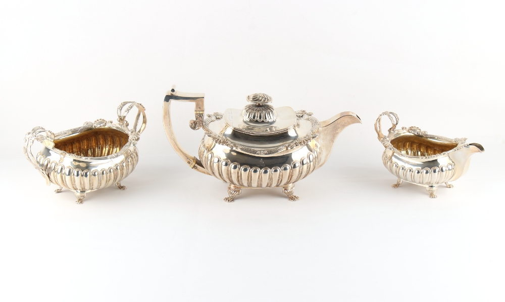 Property of a deceased estate - a good Georgian Irish silver three piece tea set, the milk jug &