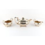 Property of a deceased estate - a good Georgian Irish silver three piece tea set, the milk jug &