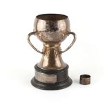 Property of a lady - a late Victorian Arts & Crafts silver three handled trophy cup, small