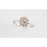 Property of a lady - a platinum or white gold diamond cluster ring, the old cut diamonds weighing an