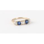 A sapphire & diamond five stone ring, the two sapphires weighing approximately 1.03 carats together,